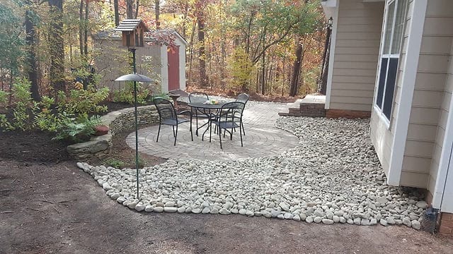 Stone patio with gravel landscaping project